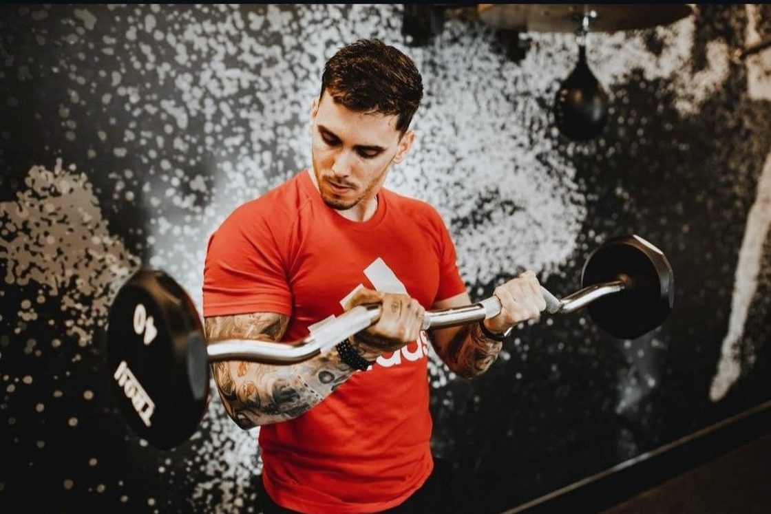 Barbell work under load — upper-body strength built set by set